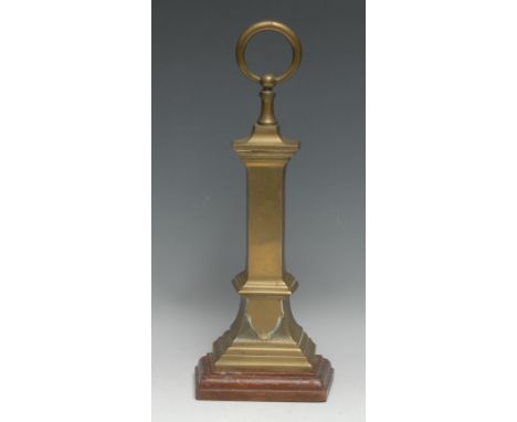 A 19th century brass country house door porter, ring terminal, stepped mahogany base, cast iron weighted, 40cm high 
