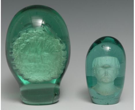 A Victorian green glass dump, sulphur inclusion inscribed Compliments of the Season, 15cm high, c. 1880; another dump paperwe