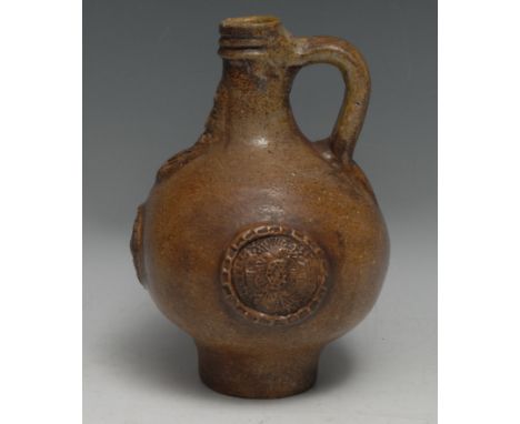 A 17th century Bellarmine brown salt-glazed stoneware jug, 21cm high, (restored and remodelled)Provenance: Found at Hardwick 