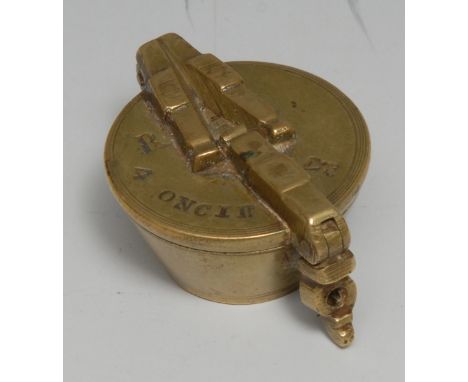 A set of North European brass nesting cup weights, the hinged cover marked R 4 Oncier, 5cm wide, 19th century 