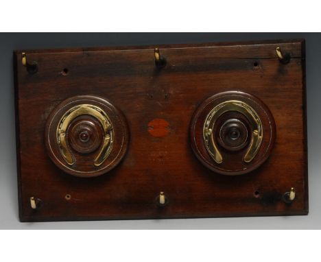 Equestrian - a mahogany country house riding whip rack, mounted with brass horse shoes and draught-turned roundels, six hooks