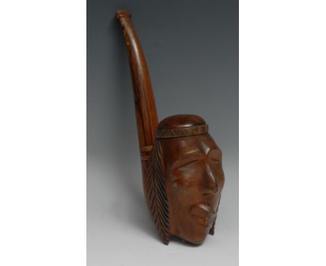 An unusual hardwood oversize pipe, the bowl carved as the head of a Native American, 33cm long 