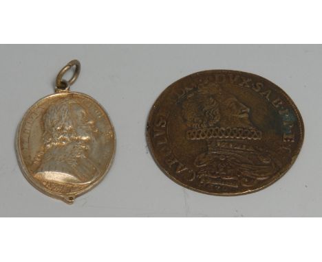 King Charles the Martyr - a silver-gilt coloured metal commemorative pendant medallion, in relief with a profile portrait of 