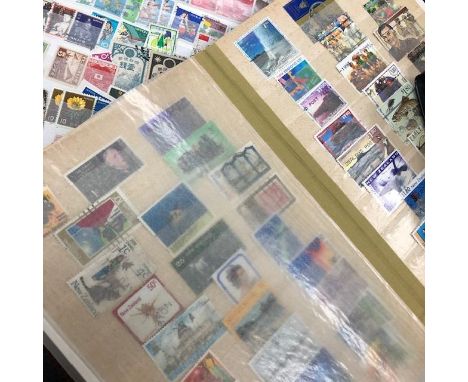 TWO ALBUMS OF STAMPS, along with a folder of First Day Covers (3)