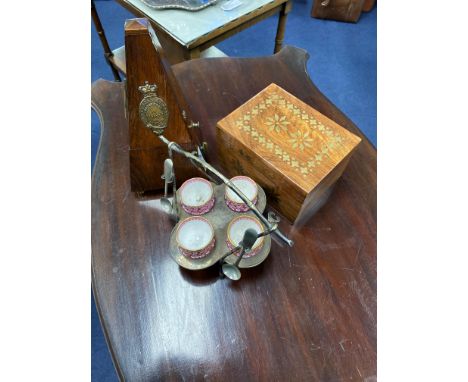 FRENCH METRONOME, 24cm high, along with a brass inlaid casket and a silver plated and porcelain egg epergne (3)