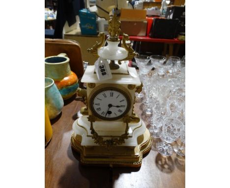     A 19th Century Alabaster &amp; Gilt Metal Mantel Clock On A Wooden Plinth           