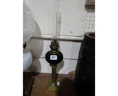     A Square Based Brass Column Peg Lamp With Green Glass Reservoir                 