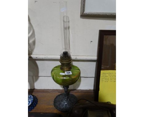     A Circular Pewter Based Oil Lamp With Green Tinted Glass Reservoir              