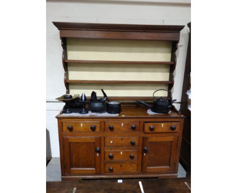     An Antique Oak Anglesey Dresser Having A Three Shelf Rack, The Base Having An Arrangement Of Cupboards &amp; Drawers, 64"