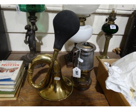     A Brass Motor Horn, Together With A Miners Safety Lamp                          