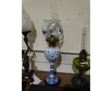 A Circular Based Blue &amp; White Ceramic Oil Lamp