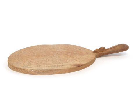 Robert 'Mouseman' Thompson English oak cheese chopping board of standard form, with carved mouse motif on handle, 38cm