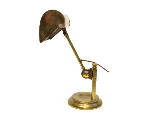 Mid 20th-century brass desk lamp, rectangular shade supported on adjustment rod, loaded circular base incorporating desk tidy