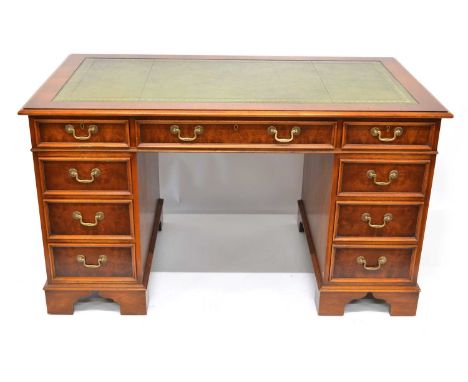 Late 20th-century mahogany twin pedestal writing desk, rectangular top with green tooled leather inset, three frieze drawers 