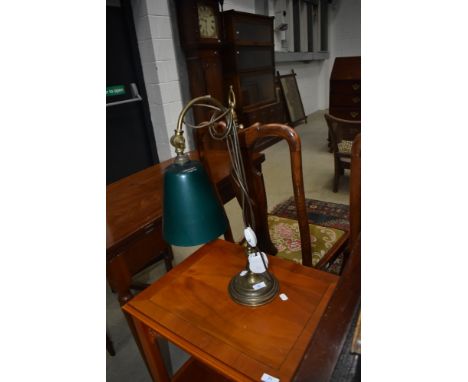 A vintage brass desk lamp