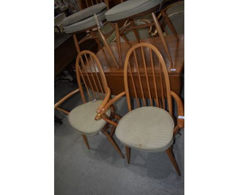 A pair of Ercol hoop and stick back carver chairs
structurally good, some slight age related scratches.