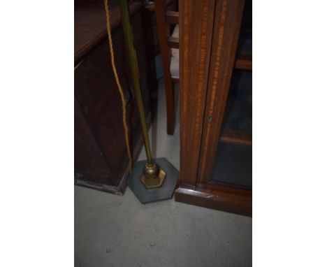A vintage brass standard lamp