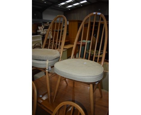 A pair of Ercol hoop and stick back dining chairs
structurally good, some slight age related scratches, some minor knocks.