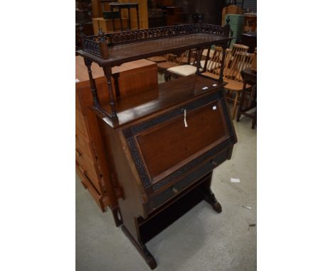 A late 19th or early 20th Century mahogany bureau of nice proportions having blind fretwork and galleried shelf, width approx