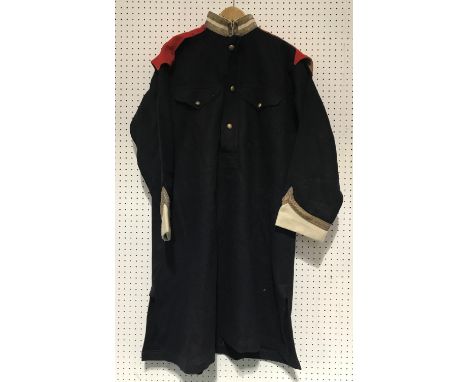 AN OFFICERS CLOAK AND SIMILAR SMOCK. A heavy dark blue and red lined cloak, with crowns to the epaulettes, all other insignia