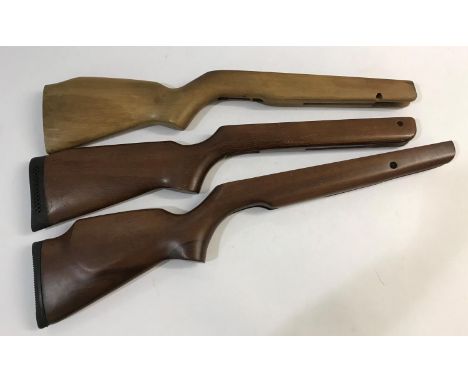 THREE WOODEN AIR RIFLE STOCKS. Three various wooden Air Rifle stocks, two with rubber shoulder mounts, 71cm long and smaller 