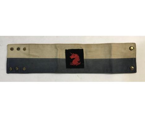 A ROYAL SIGNALS ARM BAND WITH UNICORN PATCH. A grey and white Royal Signals arm band or brassard, stamped to the reverse '232