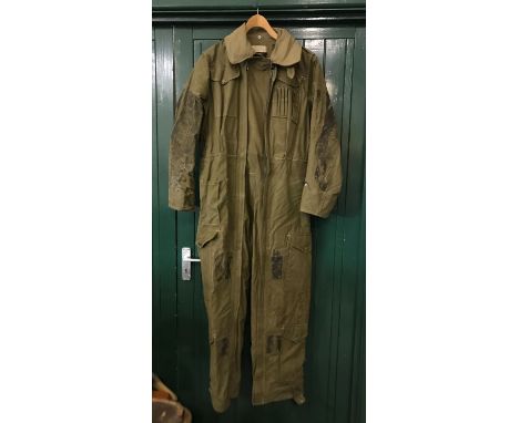 KHAKI DENIM TANK OVERALLS. A set of heavily used British Army tank overalls with numerous pockets and double zip front. Proba