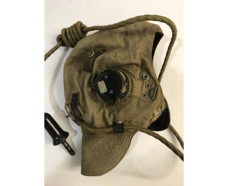 A SECOND WORLD WAR FLYING HELMET AND ACCESSORIES. A second world war RAF D type cotton flying helmet fitted with ear pieces A