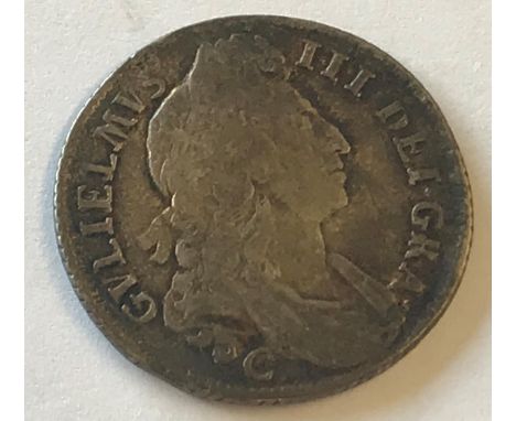 A WILLIAM III SHILLING. A William III Shilling dated 1696, first draped bust r, reverse with crowned cruciform shield, 'C' be