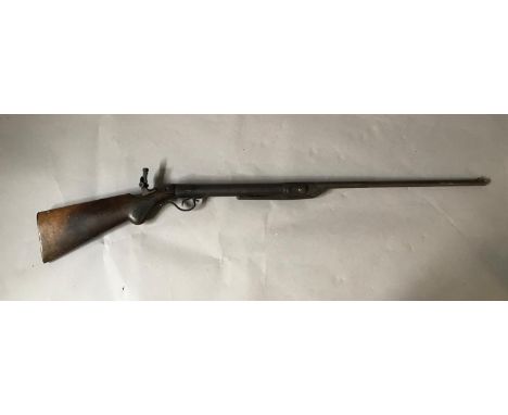 AN EARLY 20TH CENTURY .177 AIR RIFLE. An early 20th century air rifle with walnut stock, later foresight, 49.7cm barrel and a