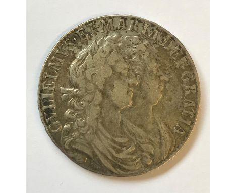 A WILLIAM AND MARY HALFCROWN. A William and Mary Halfcrown dated 1689, double bust portrait right, raised lettering on edge A