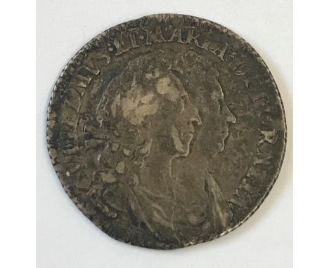 A WILLIAM AND MARY SIXPENCE. A William and Mary Sixpence dated 1693, conjoined busts r, reverse cruciform shields with WM mon