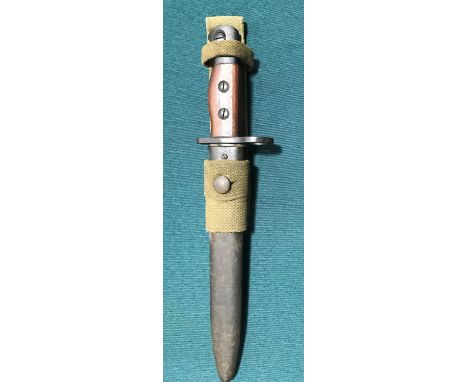 A BRITISH No 5 MK 1 BAYONET AND SCABBARD. A British No 5 Mk 1 bayonet with a 20cm pointed fullered blade stamped P in a circl