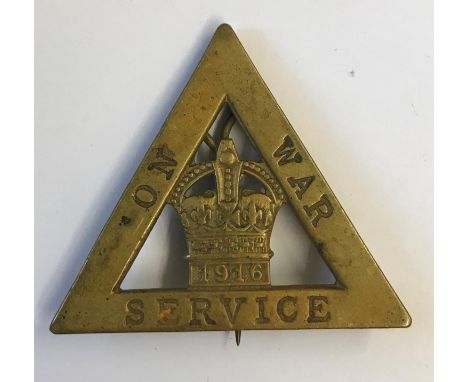 A FIRST WORLD WAR 'WAR SERVICE' BADGE AND OTHER ITEMS. A first world war 'On War Service 1916' badge by 'Wylie &amp; Co Londo