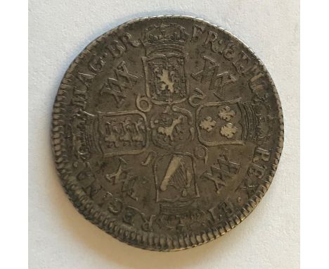 A WILLIAM AND MARY SHILLING. A William and Mary Shilling dated 1692, conjoined busts r, reverse crowned cruciform shields  wi