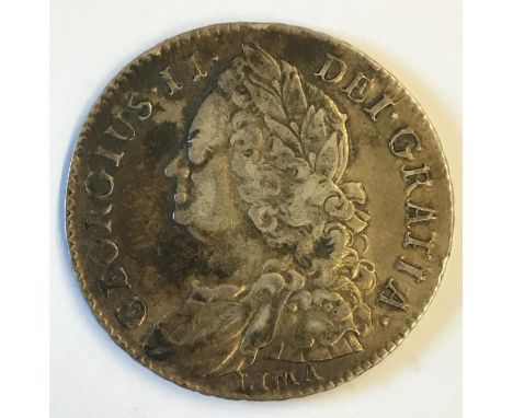 A GEORGE II HALFCROWN. A George II Halfcrown dated 1745, old and laureate bust l, reverse with plain angles and LIMA below th