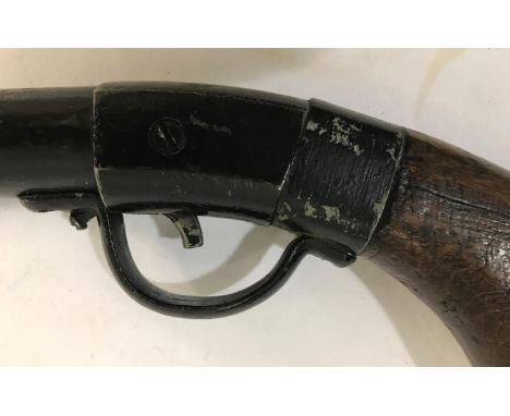 A VINTAGE AIR RIFLE. A .22 vintage air rifle probably repainted and apparently unmarked. 107cm long, with previous owners nam