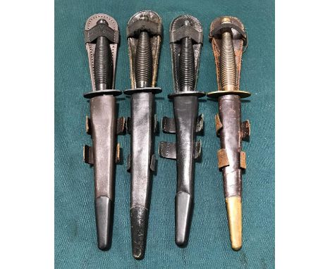 A SYKES FAIRBAIRN TYPE COMMANDO FIGHTING KNIFE AND OTHERS. A Commando fighting knife with a double edged 18cm blade with a mo