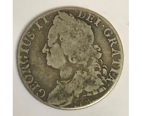 A GEORGE II SHILLING. A George II Shilling dated 1745, old laureate draped bust l, reverse with LIMA below the bust and plain