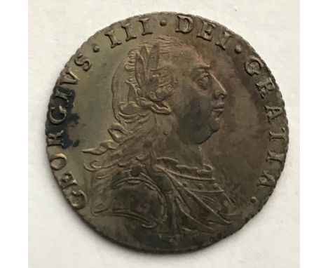 A GEORGE III SIXPENCE. A George III Sixpence dated 1787, laureate and draped bust r, with semee of hearts.