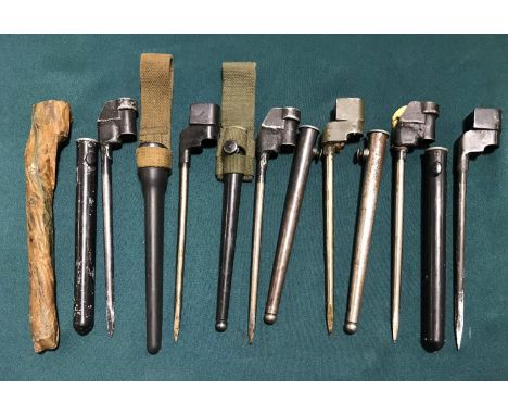 A COLLECTION OF SEVEN SIMILAR No 4 MKII BAYONETS AND SCABBARDS. A collection of seven similar No4 MkII spike Bayonets with sl