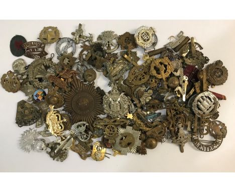 A LARGE COLLECTION OF CAP BADGES AND SHOULDER TITLES. A large collection of shoulder, cap and similar badges to include Royal