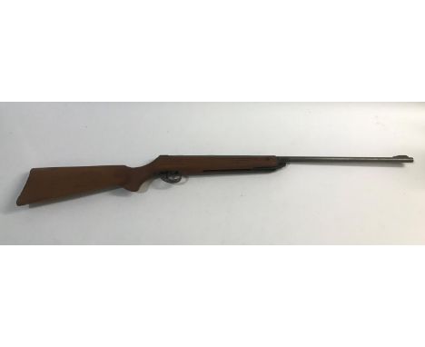 A B.S.A. METEOR AIR RIFLE. A .22 B.S.A. Meteor Air Rifle with a 45.5cm barrel and wooden stock, 105cm overall.