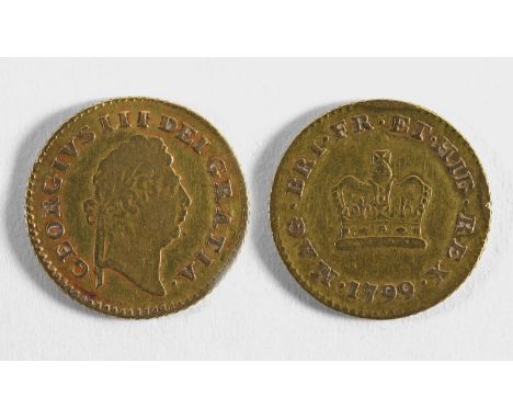A GEORGE III GOLD THIRD-GUINEA. A George III Third-Guinea dated 1799, first laureate head r, reverse crown, c2.7g.
