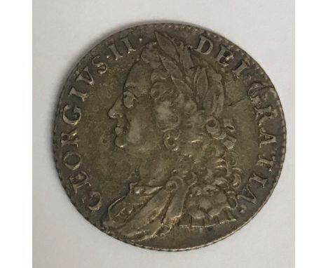 A GEORGE II SHILLING. A George II Shilling dated 1758, old laureate draped bust r, reverse with plain angles.