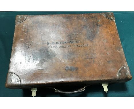A TRAVELLING CASE BELONGOGN TO R. MORTON WOOD OF THE 6TH INNISKILLINGS. A fitted leather suitcase, the lid marked 'R. Morton 