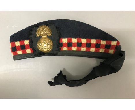 A ROYAL SCOTTISH FUSILIERS GLENGARRY. A Glengarry with checkered banding and ribbons with Royal Scottish Fusiliers badge, and