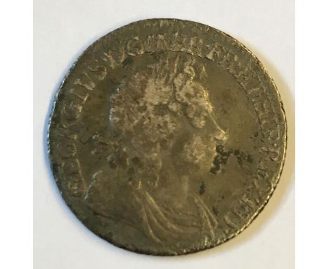 A GEORGE I SHILLING. A George I Shilling dated 1720, first laureate and draped bust r. 