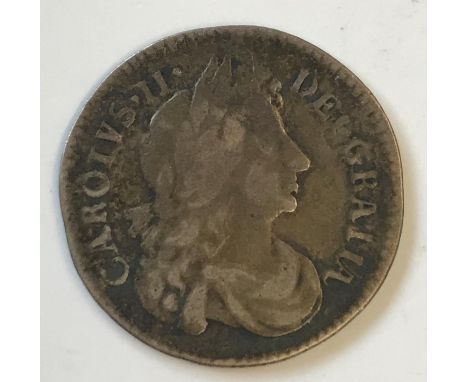 A CHARLES II SIXPENCE. A Charles II Sixpence dated 1683, draped bust r, reverse with crowned cruciform shields and interlinke