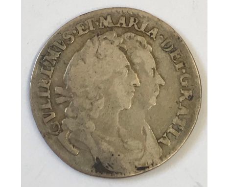 A WILLIAM AND MARY SIXPENCE. A William and Mary Sixpence dated 1693, conjioned busts r, reverse with WM monogram in the angle